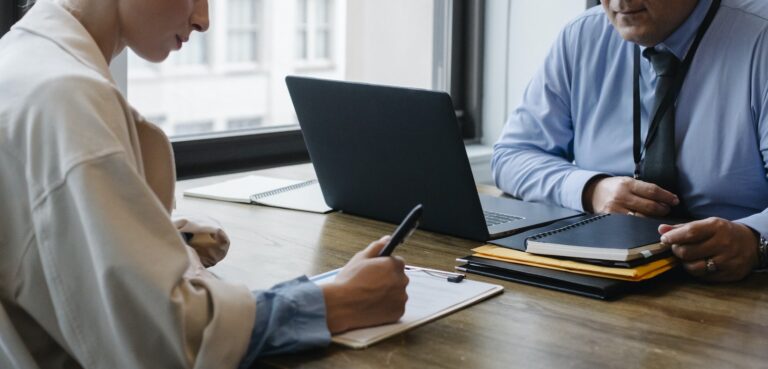 Crop business partners signing contract in office